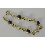 ARMBANDSilber vergoldet mit Amethysten und Mondsteinen. L.19cmA BRACELET Silver, gold-plated with