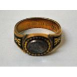 A Victorian Mourning Ring, 18ct gold, centrally set with a glass panel and plaited hair beneath