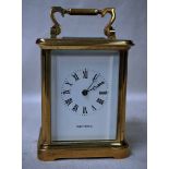A good quality heavy brass framed Carriage Clock by Mappin and Webb, platform escapement, white