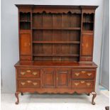 A Georgian style oak, crossbanded and inlaid Dresser with display back, ogee moulded cornice with
