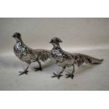 A pair of continental silver Table Pieces, modelled as a Cock and Hen Pheasant, 12.37oz, 33cm long