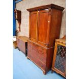 A GEORGE III MAHOGANY 2-DOOR PRESS CABINET WITH 4 SLIDES OVER A CHEST OF 7 DRAWERS