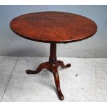 A Georgian burr elm Snap Top Table, circular two piece heavily figured top, hinged turned pedestal