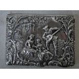 A late Victorian silver Aide Memoire, rectangular cushion form, heavily embossed with figures in a