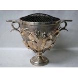 A large decorative Edwardian silver two-handled Rose Bowl, U shape body, heavily embossed with