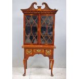 A good Georgian inlaid mahogany Bookcase on Lowboy Writing Desk base, the later carved swan neck