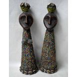 Ethnographic Interest, a pair of possibly Kenyon carved wood figures, applied beadwork and cowrie