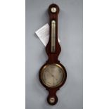 An early 19th century mahogany Wheel Barometer, of typical Banjo form, signed F. Barnasconi