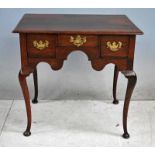 A late 18th century George III oak Lowboy of typical form, moulded edge three plank rectangular