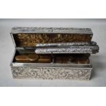 An Edwardian silver Curling Tong set in embossed silver bound box with brass integral spirit