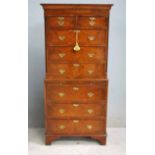 A 20th century reproduction Georgian style walnut Chest on Chest, the upper portion with moulded