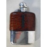 A George V silver mounted part crocodile skin covered glass Hip Flask with integral gilt lined