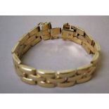 A ladies 9ct gold Bracelet, three tier brick link style, 188mm long by 15mm wide, 30.3g