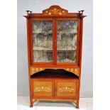 A good quality Edwardian Arts and Crafts mahogany Display Cabinet, the crested gallery style cornice