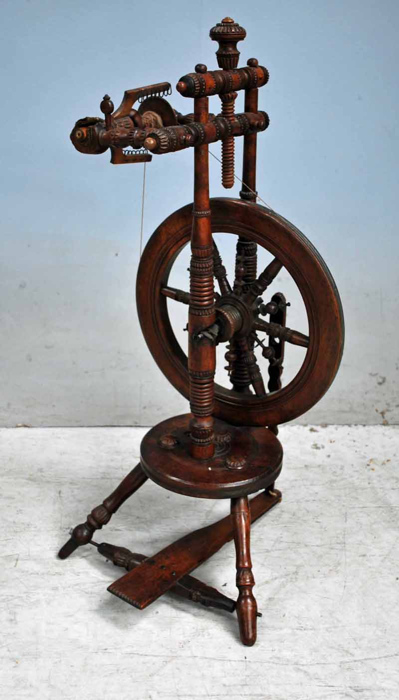 An early 19th century European Fruitwood Spinning Wheel, turned and carved frame, smaller