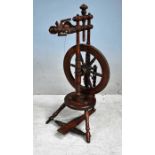 An early 19th century European Fruitwood Spinning Wheel, turned and carved frame, smaller