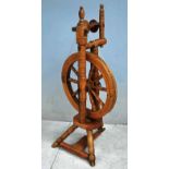 A 19th century Eastern European Fruitwood Spinning Wheel, turned supports and legs, foot treadle