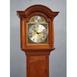 Alan Grainger (Acorn Man) of Brandsby, an oak Longcase Clock, typical form, arch top dial, brass