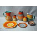 Shelley Drip Ware, orange and green, orange and brown, two Jugs, 13.5cm and 18.5cm, three Vases,