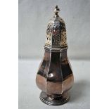 An Edwardian silver Sugar Caster of octagonal baluster form, pierced cover with knop, on raised