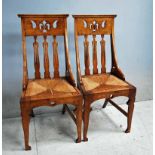 A set of four good quality Arts and Crafts oak Dining Chairs, moulded edge top rail above pierced