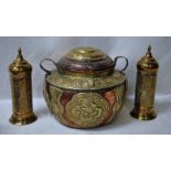 A Tibetan copper and brass two-handled covered vessel, heavily embossed with foliate design,