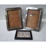 A pair of Edwardian silver freestanding Photograph Frames with oak backs, 18.5cm by 13.5cm and a