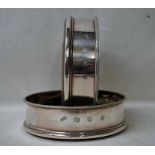 A pair of late 20th century silver Wine Bottle Coasters, circular wooden bases, London 1974, 12cm