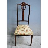 An Arts and Crafts Mahogany Bedroom chair, arched back rail, pierced central splat in organic design