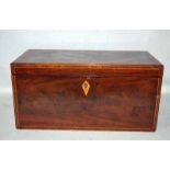 A 19th century line inlaid mahogany Tea Caddy of rectangular form, hinged lid enclosing a central