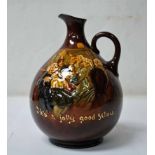 A Royal Doulton Kingswear Jug, this rich brown jug features Jolly Revellers singing 'He's a Jolly