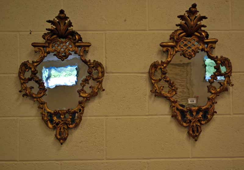 A fine pair of 18th century Italian carved and gilded Rococo Wall Mirrors with original glass,
