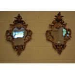 A fine pair of 18th century Italian carved and gilded Rococo Wall Mirrors with original glass,