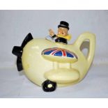 A Carlton Ware novelty Teapot modelled as Winston Churchill flying a biplane, scratched black