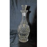 A Waterford tall Colleen Decanter, round bodied and deep diamond cut with faceted stopper, marked '