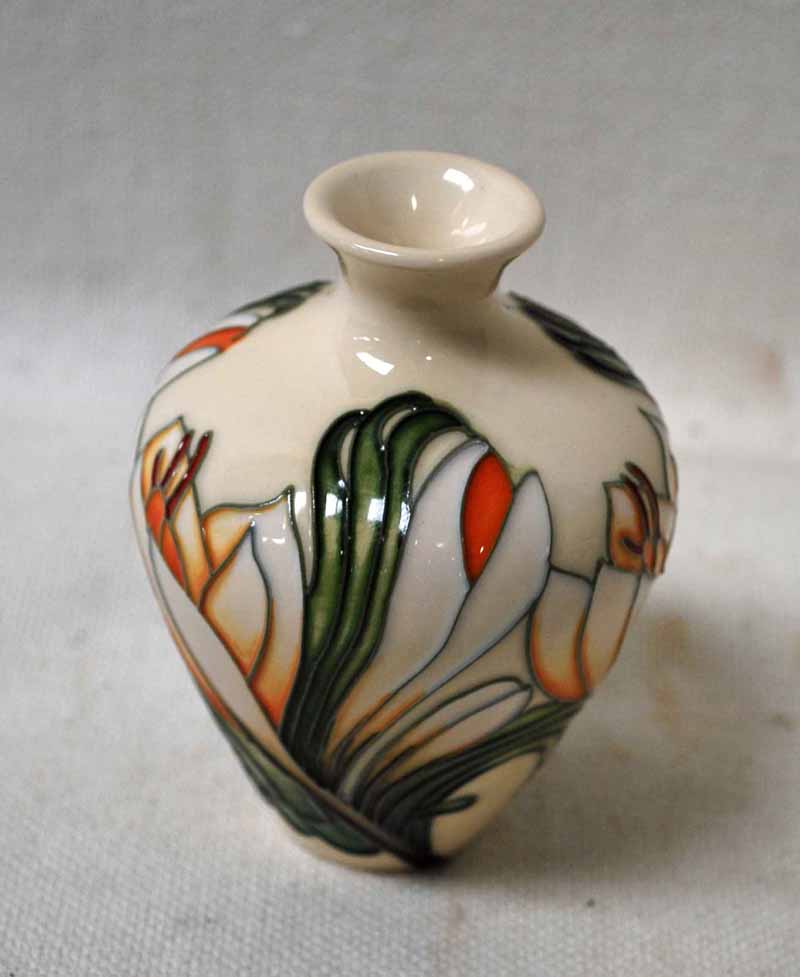 A Small Moorcroft Vase of baluster shape in the Crocus Pattern on a cream ground, indistinctly