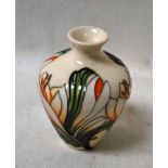 A Small Moorcroft Vase of baluster shape in the Crocus Pattern on a cream ground, indistinctly
