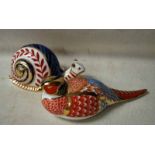 A Royal Crown Derby Desk Weight as a Pheasant, no stopper, 18cm long and another as a Snail, no