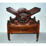 A George IV Rosewood Canterbury, the dividers centred with laurel wreaths, the base with acorn