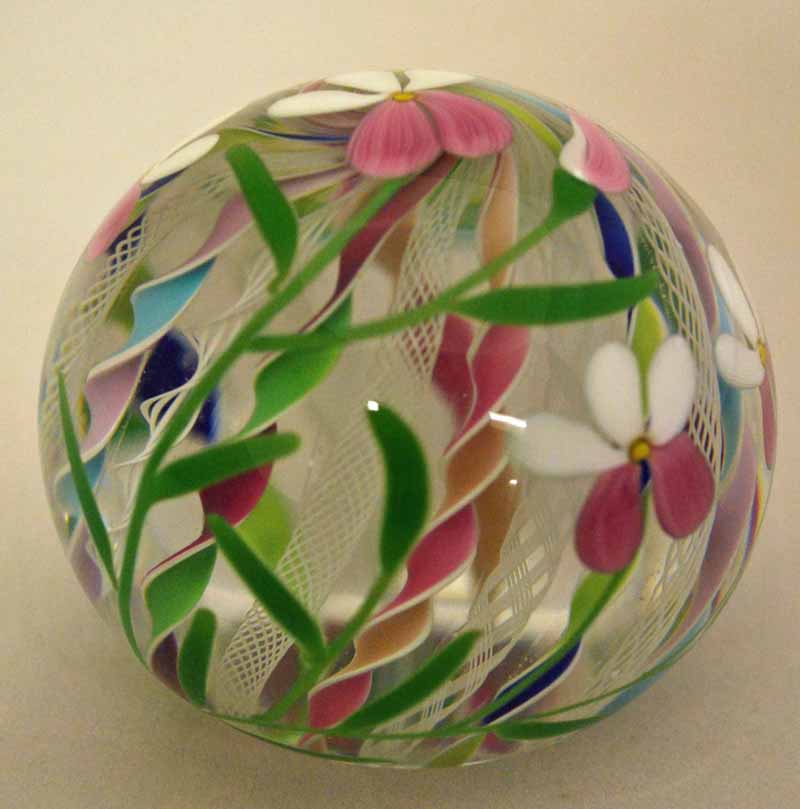 A Michael James Hunter Twists Studio Glass Paperweight, limited edition 7/20, multi-flower twist