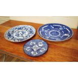 Three oriental blue and white plates, early to late 20th century, 26-46cm diameter