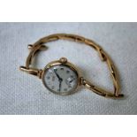 A 9ct gold ladies Vertex Revue Wrist Watch on 9ct gold expanding strap, Birmingham 1984, 17.8g gross