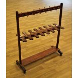 A Georgian mahogany Boot and Crop Rack, complete with rack for boots and whips or crops, turned