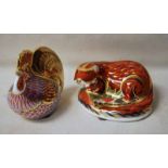 A Royal Crown Derby Desk Weight as an Otter, gold stopper, 11.5cm long and another as a Cockerel,