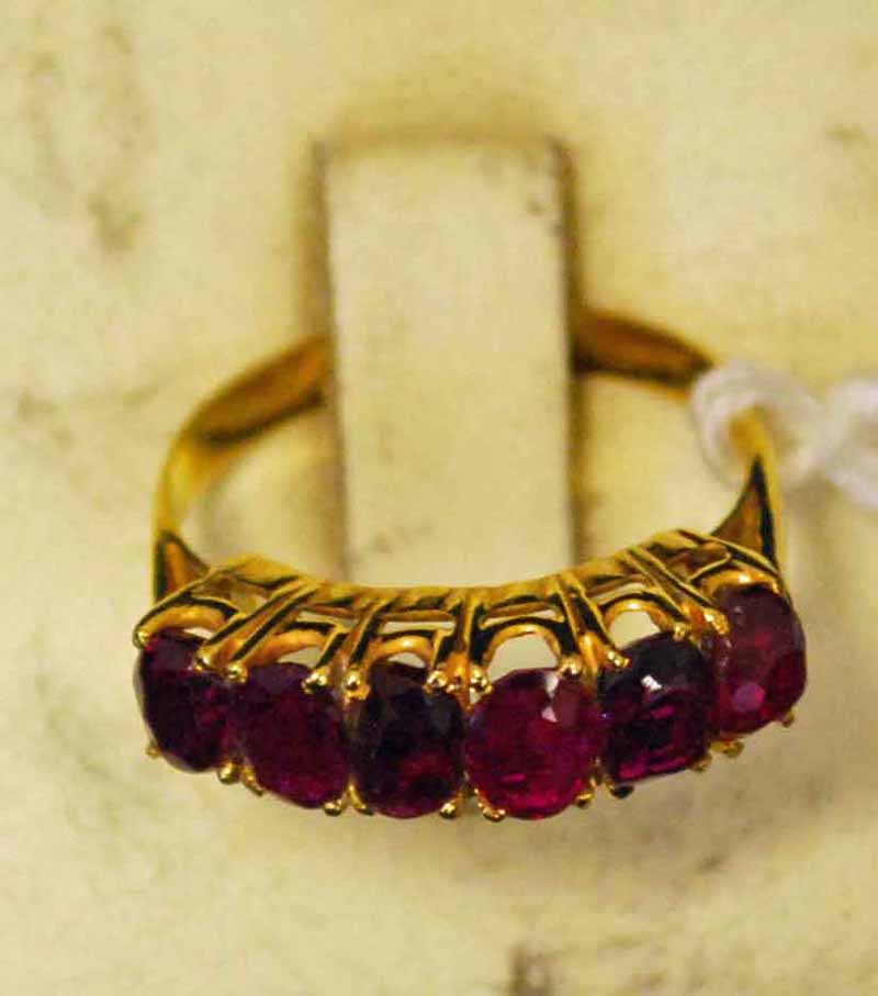 A Burmese ruby banded Ring, six stones, 18ct gold, tested, size M, marked tested 18c