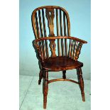 A 19th century Ash and Elm stick back Windsor Armchair with Crinoline Stretcher, pierced central