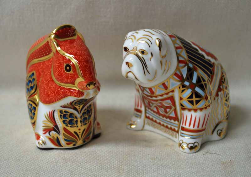 A Royal Crown Derby Desk Weight as a seated Bulldog, silver stopper, 9cm high and another as a