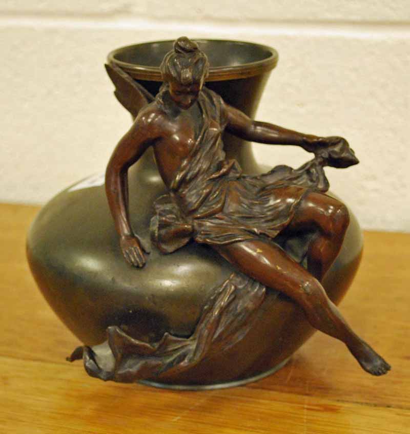 A patinated Spelter Art Nouveau style Vase with a female figure reclining across the front, with