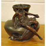 A patinated Spelter Art Nouveau style Vase with a female figure reclining across the front, with