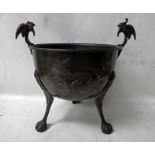 An early 20th century Arts and Crafts three-legged copper Jardiniere, U form, embossed with bird and